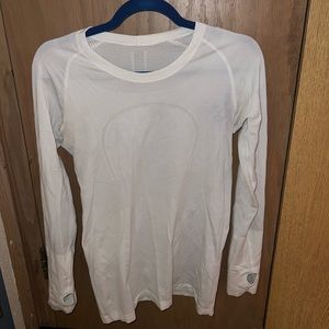 Size 8 Swiftly Tech Long-Sleeve Shirt in the color white.
